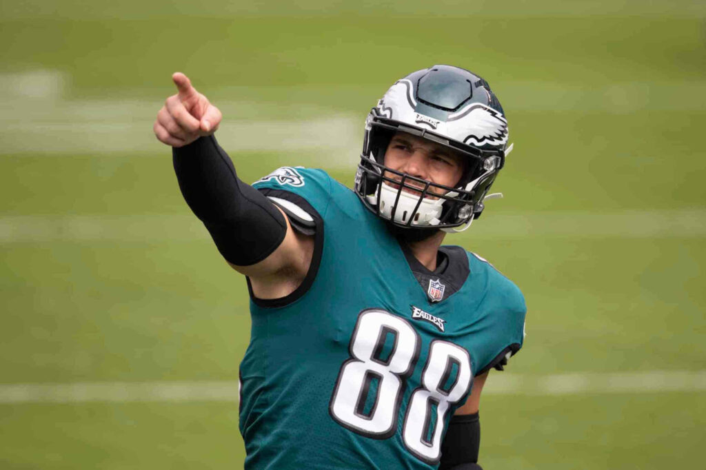 Dallas Goedert in Philadelphia Eagles uniform points forward on field showing focus and intensity Wallpaper