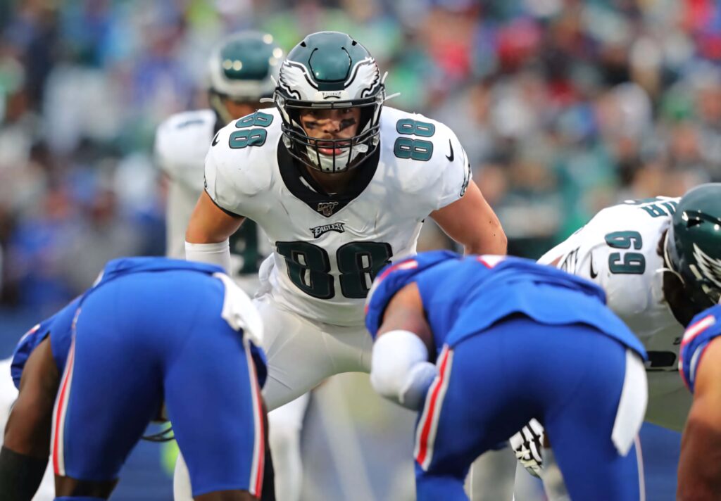 Dallas Goedert in Philadelphia Eagles uniform focused at line of scrimmage vibrant game day scene Wallpaper