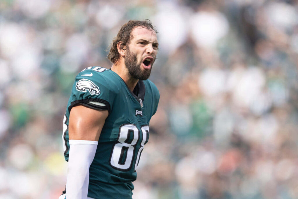 Dallas Goedert Philadelphia Eagles intense action close-up blurred stadium vibrant green white colors Wallpaper