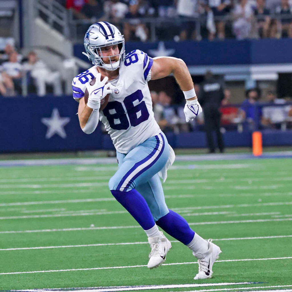 Dalton Schultz Dallas Cowboys tight end in action NFL vibrant blue and white team colors wallpaper
