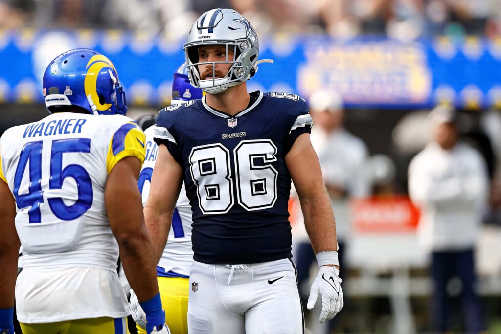 Dalton Schultz Cowboys number 86 faces Bobby Wagner Rams 45 intense football game wallpaper