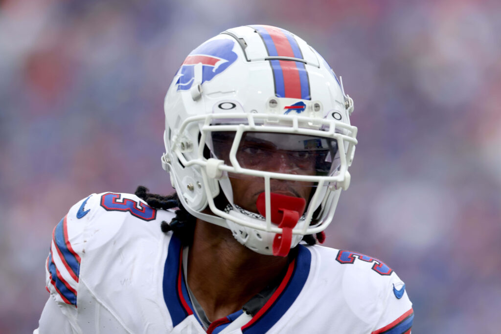 Damar Hamlin in Buffalo Bills uniform focused on football field action vibrant sports wallpaper
