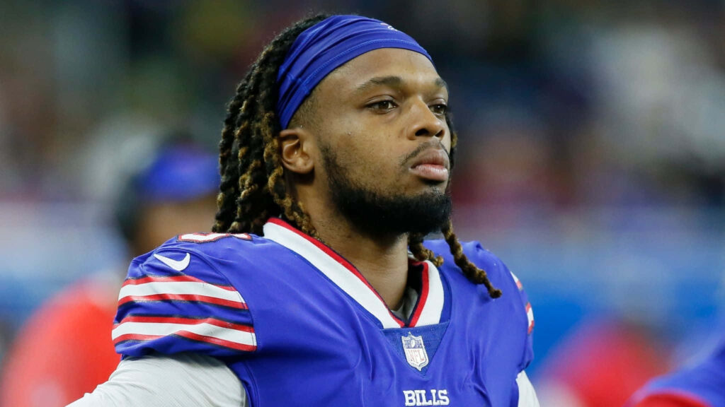 Damar Hamlin in Buffalo Bills jersey focused profile shot with blurred stadium background wallpaper