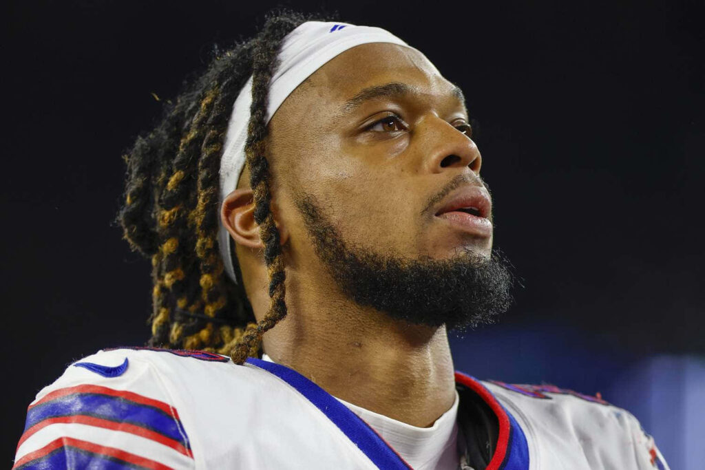 Damar Hamlin Buffalo Bills portrait intense expression braided hair detailed jersey stadium background Wallpaper