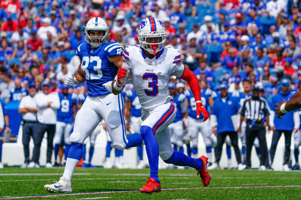 Damar Hamlin sprinting in Buffalo Bills uniform during game against Indianapolis Colts vibrant stadium Wallpaper