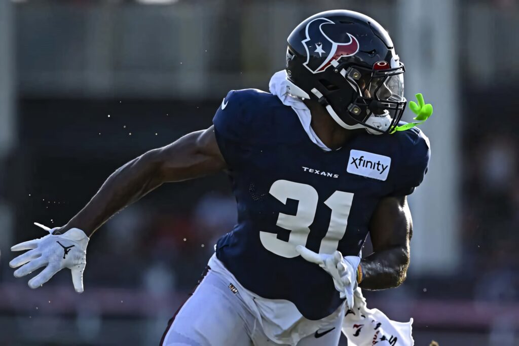 Dameon Pierce Houston Texans number 31 running in dark blue jersey action football wallpaper