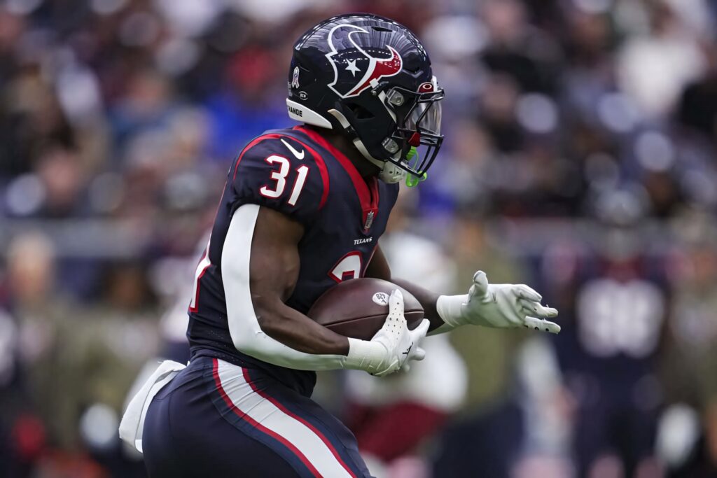Dameon Pierce Houston Texans running back in action dynamic wallpaper with bold navy red colors