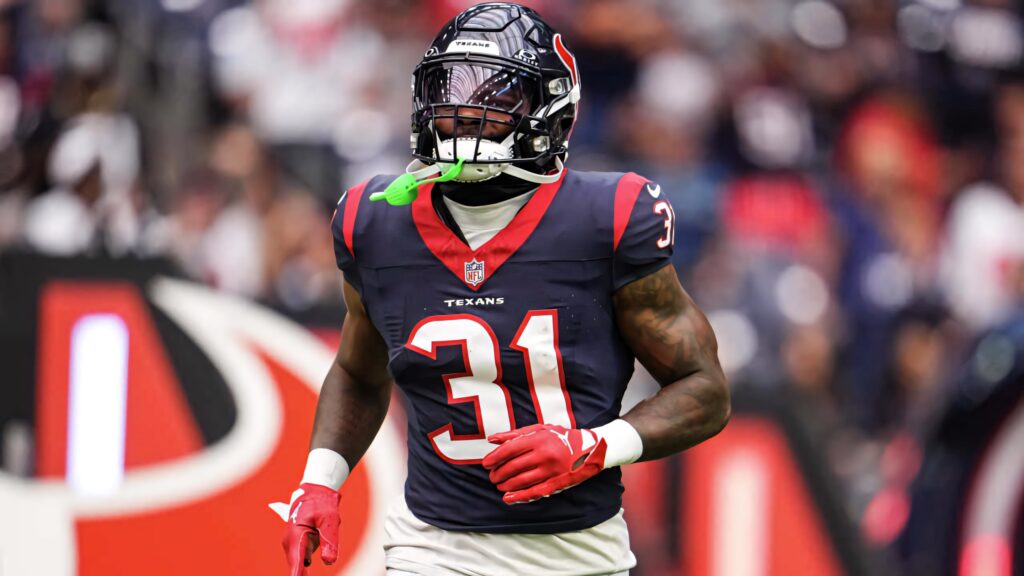 Dameon Pierce Houston Texans running back in action vivid navy red football wallpaper background
