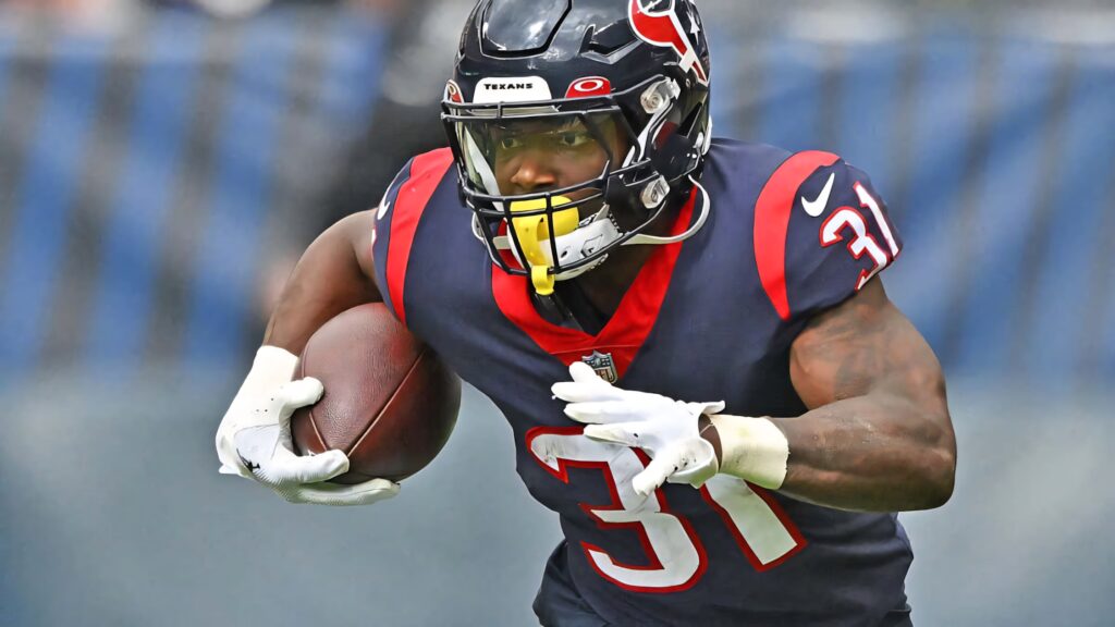 Dameon Pierce Houston Texans powerful running action football wallpaper stadium background
