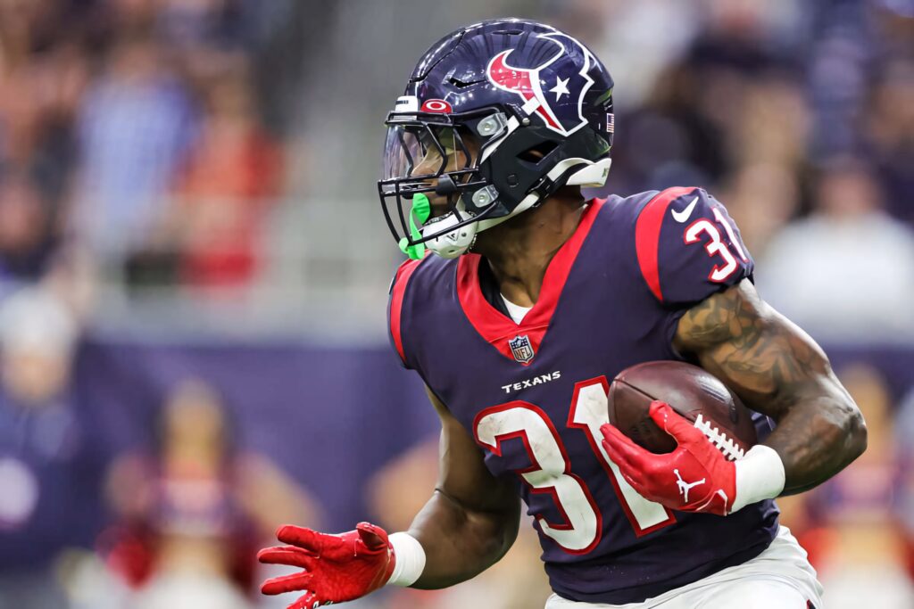Dameon Pierce Houston Texans running back in action dynamic wallpaper athleticism energy