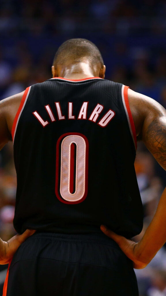 Back view of basketball player Lillard in black red jersey number zero with focused intense pose Wallpaper