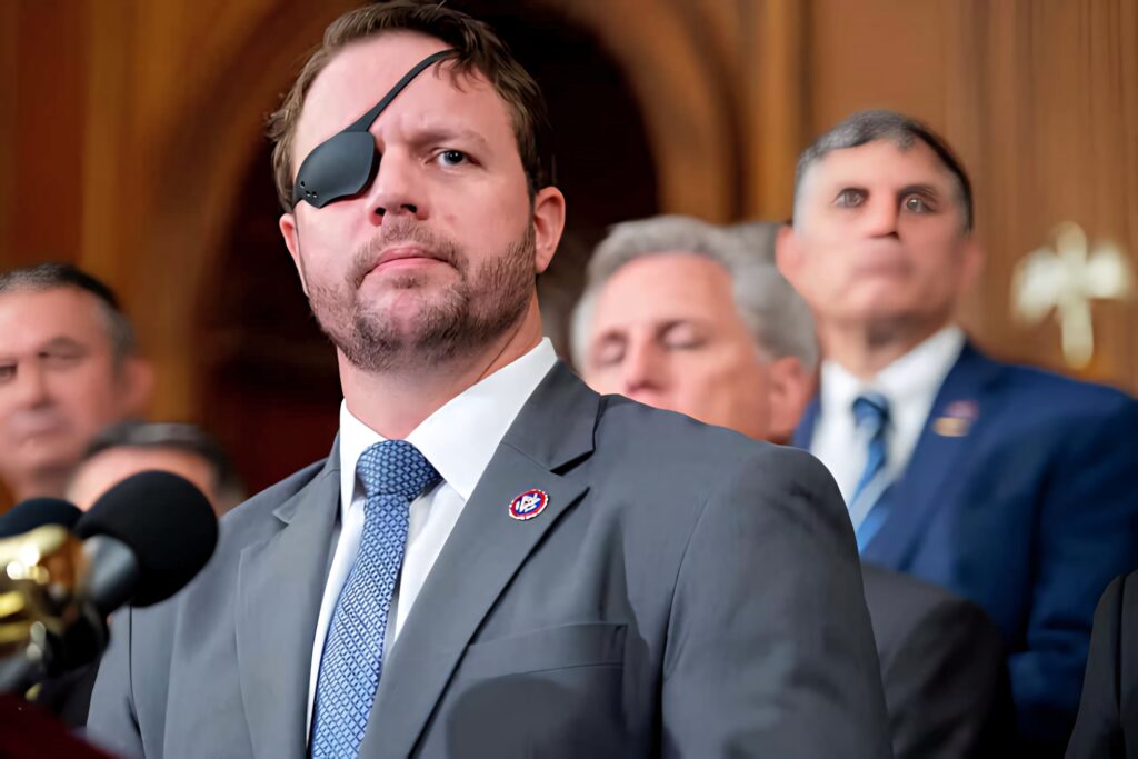 Dan Crenshaw in suit with eyepatch leading officials in formal wood-paneled room wallpaper background