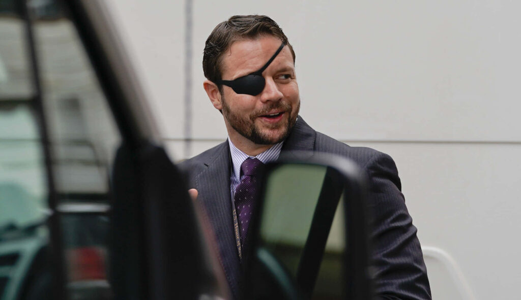Dan Crenshaw in dark suit and purple tie with eye patch urban outdoor professional portrait wallpaper