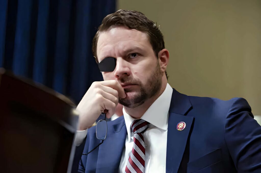 Dan Crenshaw portrait in navy suit with eyepatch on blurred background professional wallpaper