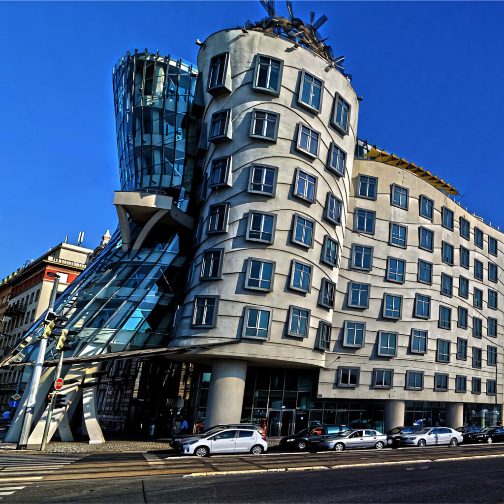 Dancing House Prague vibrant wallpaper modern deconstructivist architecture blue sky background
