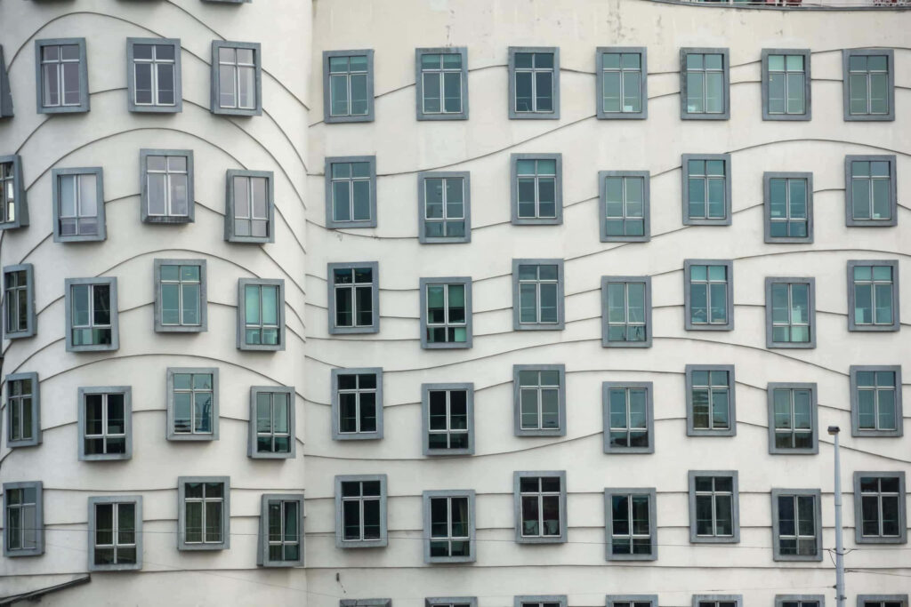 Dancing House Prague wallpaper featuring wavy facade and modern deconstructivist architecture design