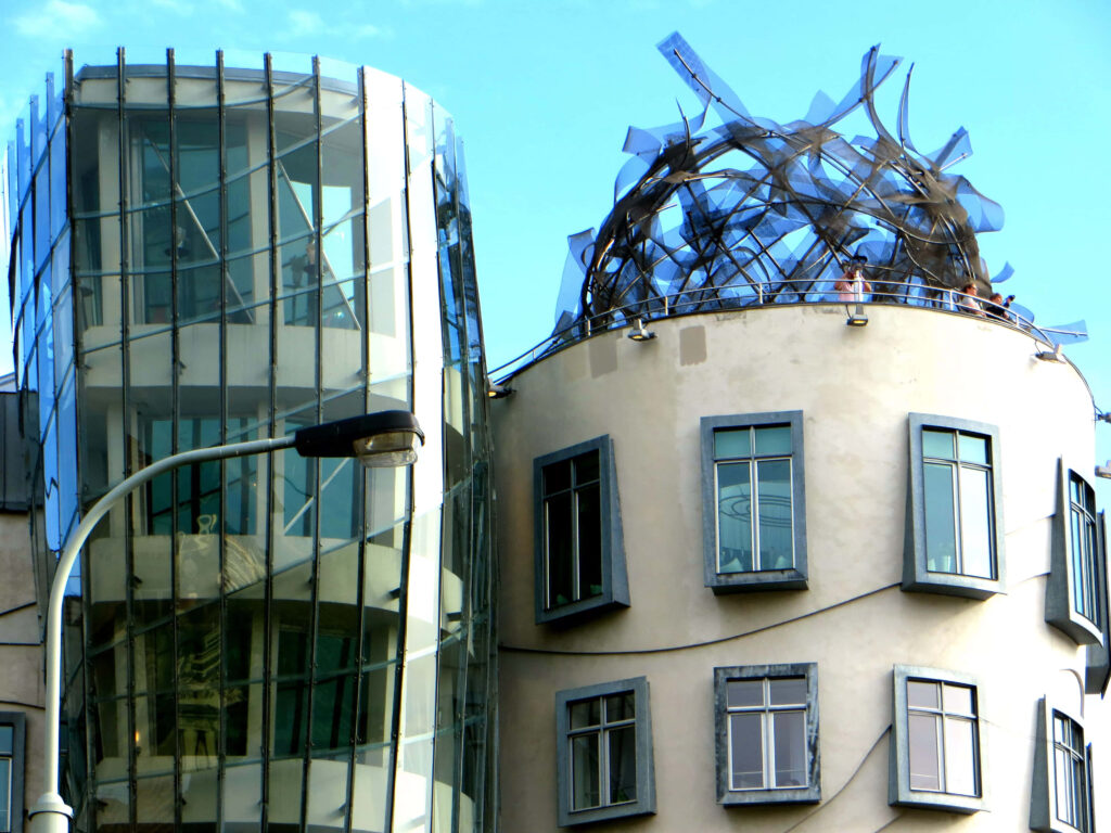 Dancing House Prague vibrant wallpaper unique curved glass concrete architecture blue sky