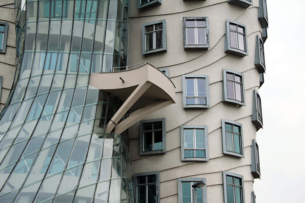 Dancing House Prague wallpaper featuring deconstructivist architecture with curved glass panels
