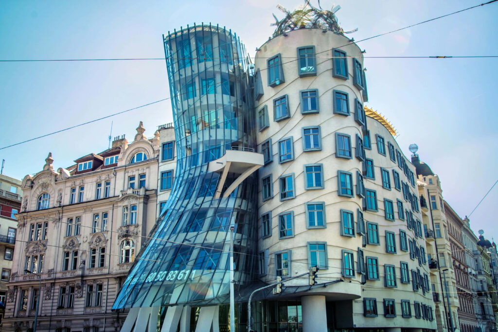 Dancing House Prague wallpaper modern architecture curving glass concrete dynamic silhouette blue sky