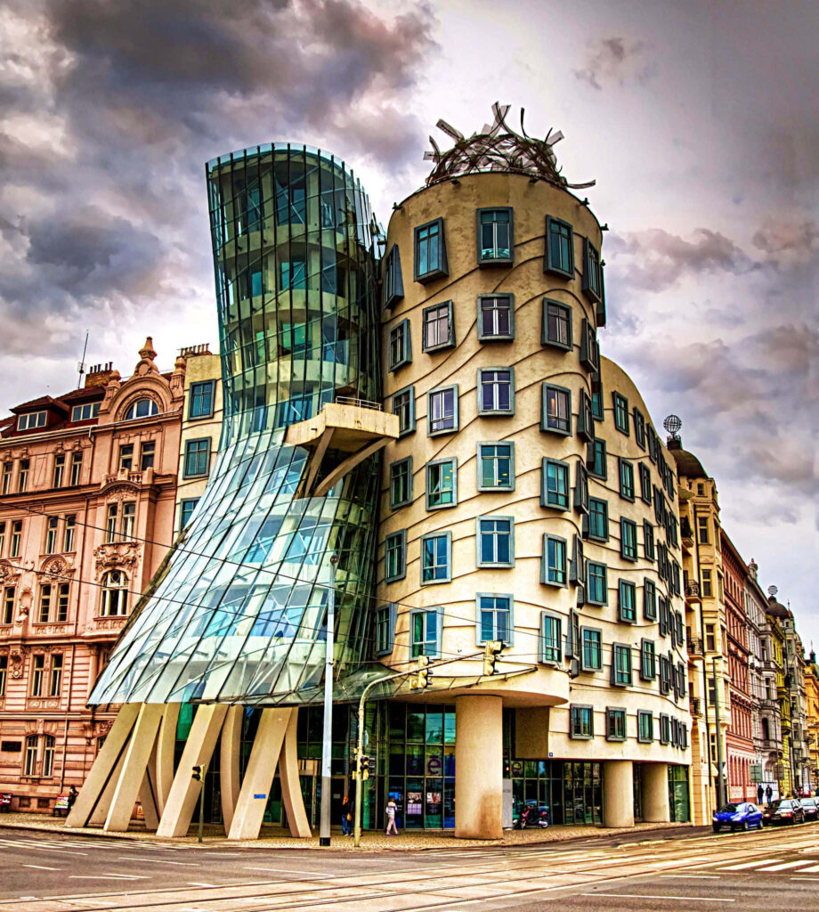 Dancing House Prague vibrant wallpaper modern deconstructivist architecture cloudy sky background