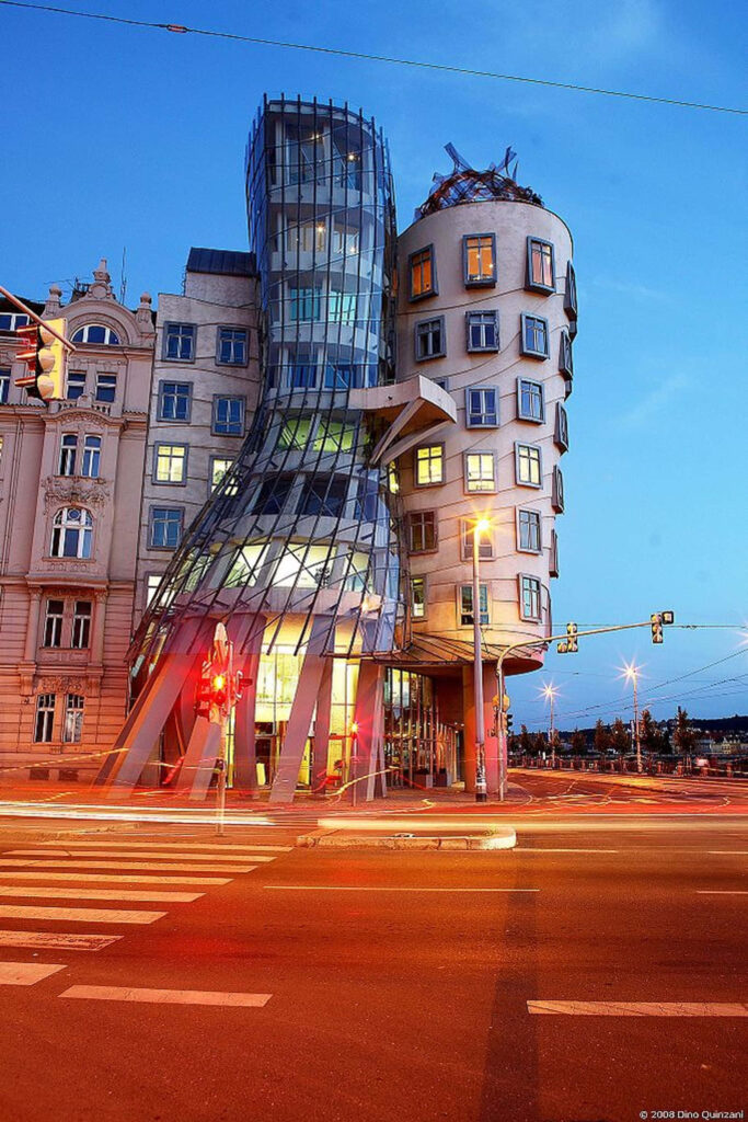 Dancing House Prague modern architecture with curving glass and concrete at evening sky wallpaper