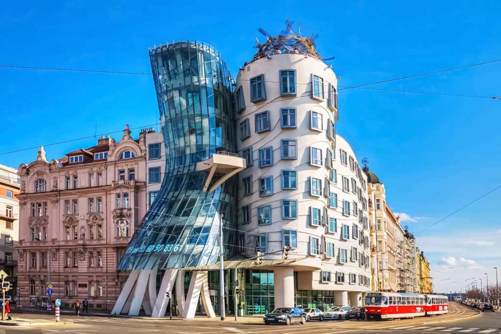 Dancing House Prague vibrant wallpaper modern curved glass architecture blue sky background