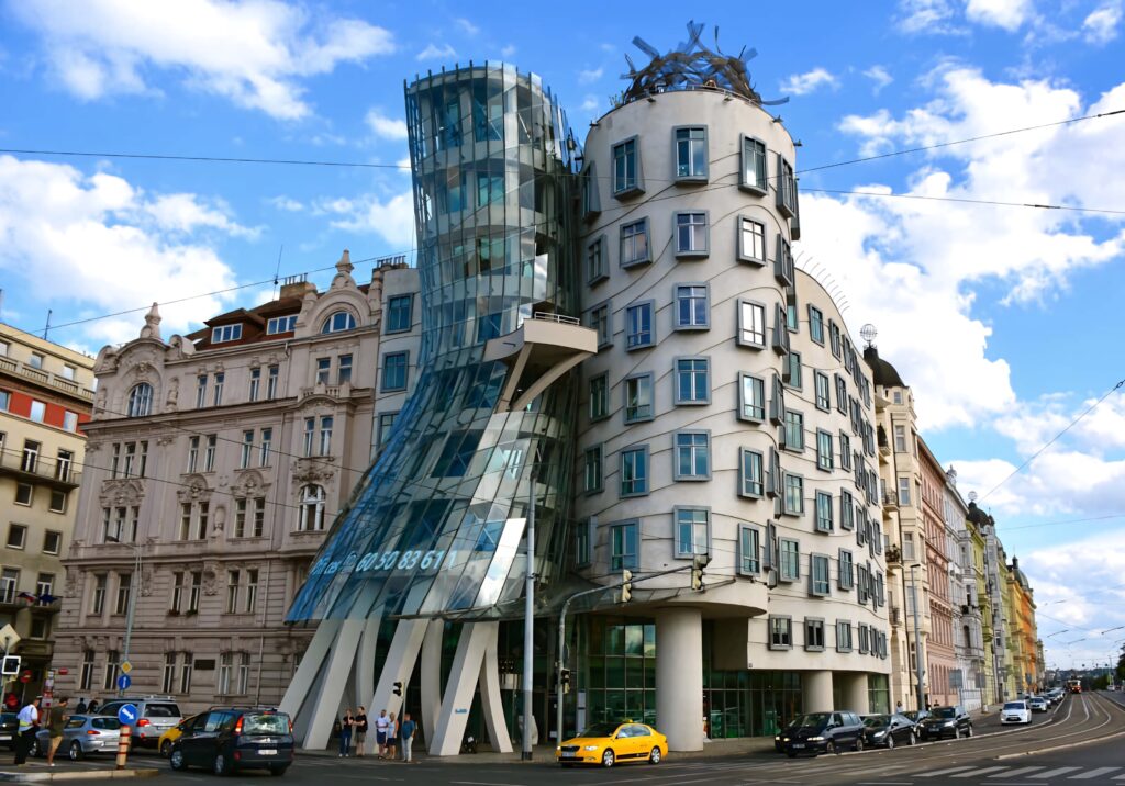 Dancing House Prague vibrant wallpaper unique deconstructivist architecture blue sky background