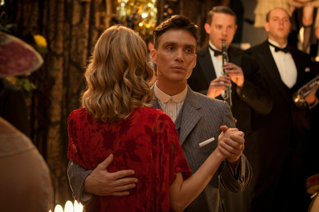 Electrifying Dance: Tommy and Grace Sparkle in this Peaky Blinders 8k Wallpaper