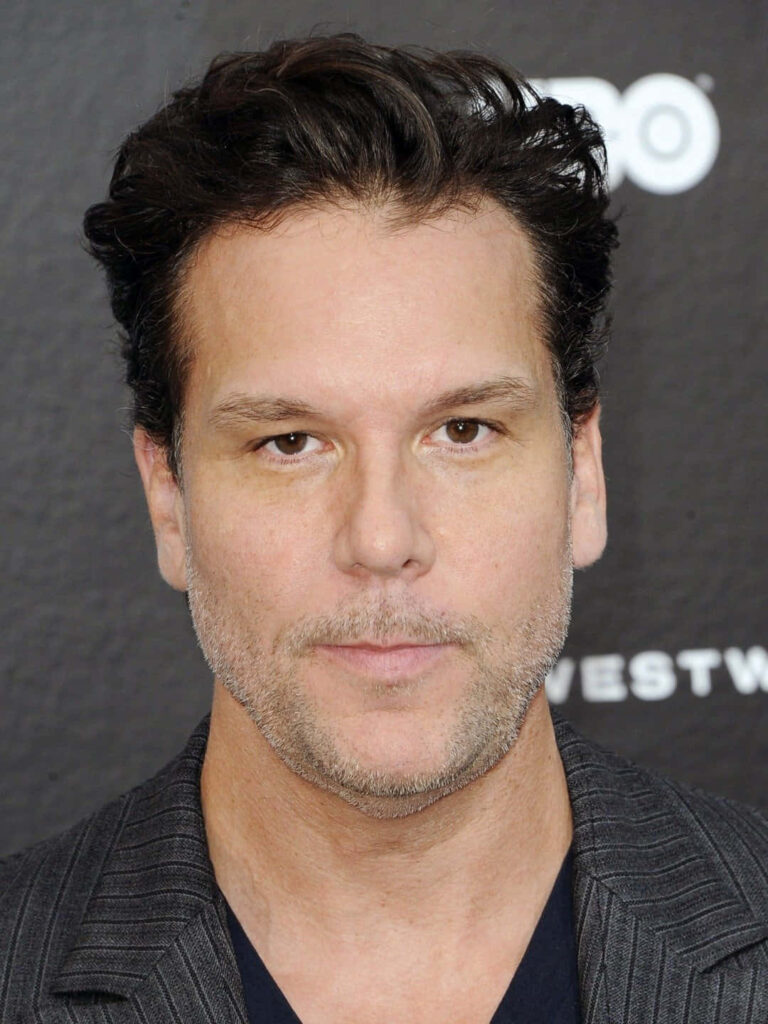 Dane Cook portrait wallpaper with expressive face confident gaze dark textured background