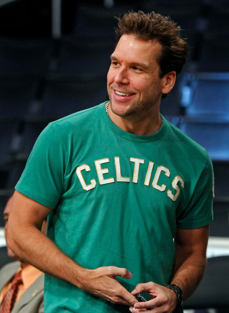 Dane Cook smiling in bright green Celtics t-shirt vibrant wallpaper with blurred background