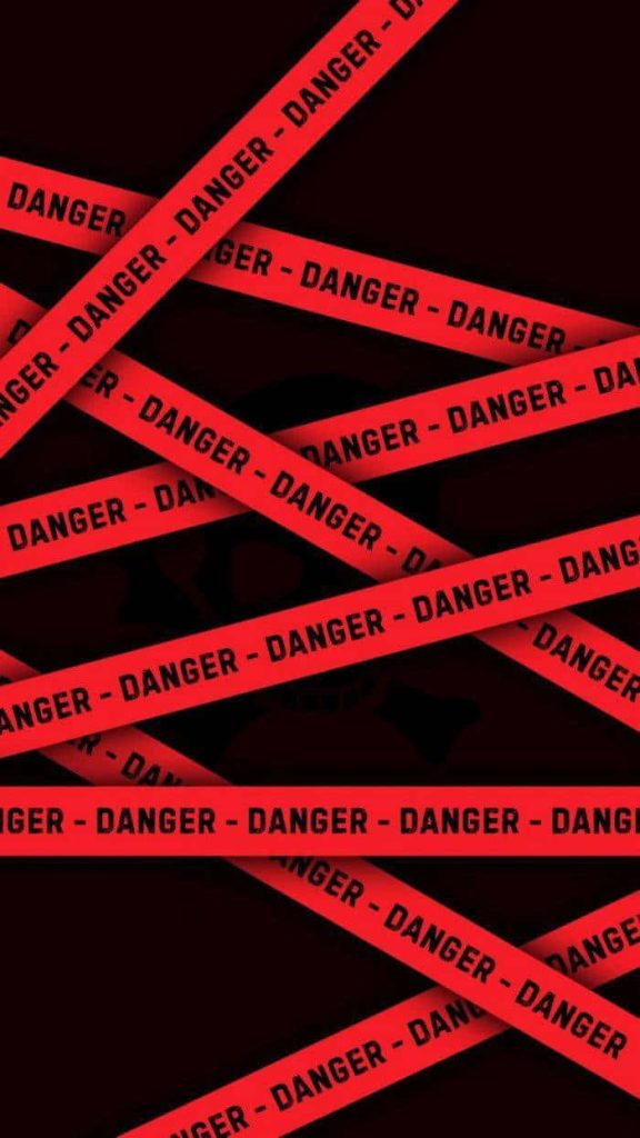 Bold Danger Tape wallpaper with red stripes and subtle skull on black background for edgy look