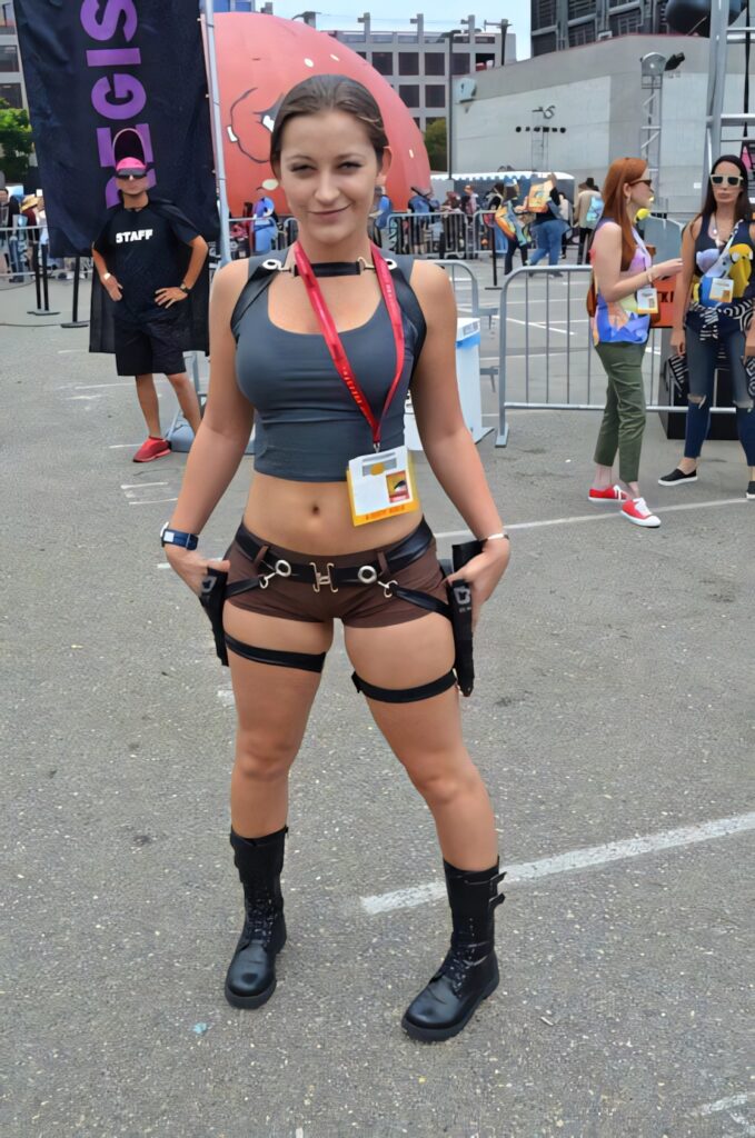 Dani Daniels in action costume with tactical gear cropped tank top harness belt combat boots outdoors Wallpaper