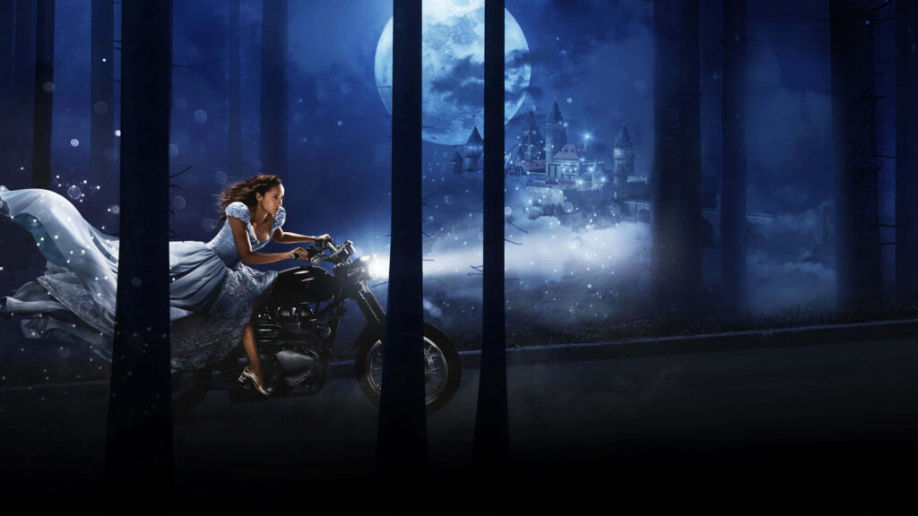 Dania Ramirez rides motorcycle in flowing gown through mystical forest under glowing full moon Wallpaper