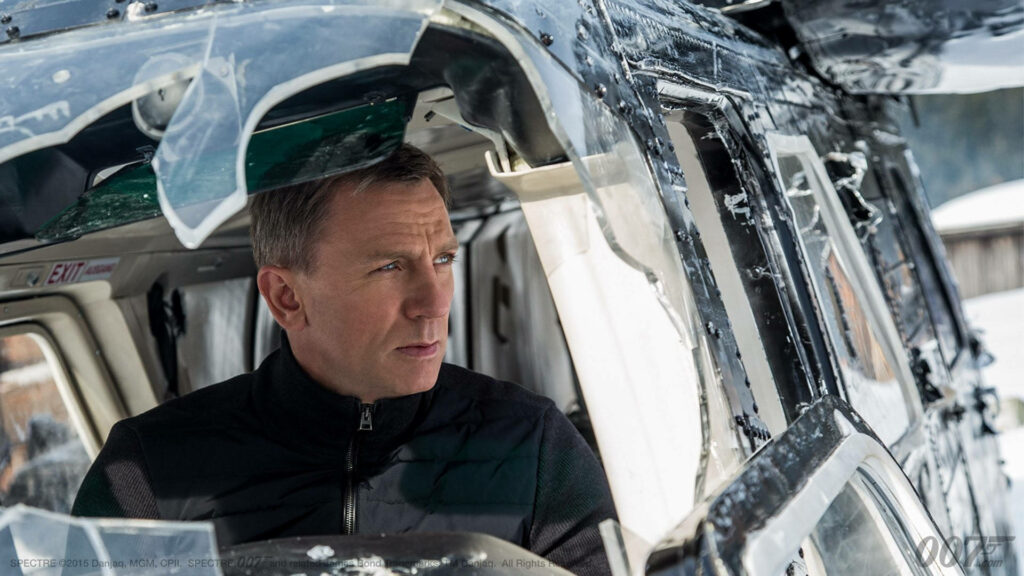 Daniel Craig as James Bond inside damaged helicopter intense action scene from Spectre trailer wallpaper