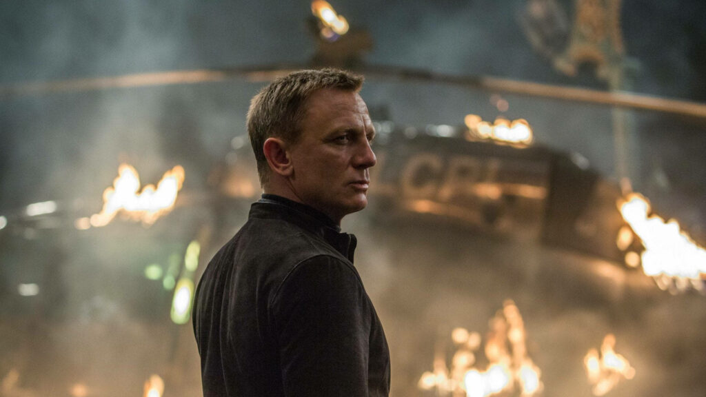 Daniel Craig as James Bond in intense fiery action scene wallpaper background