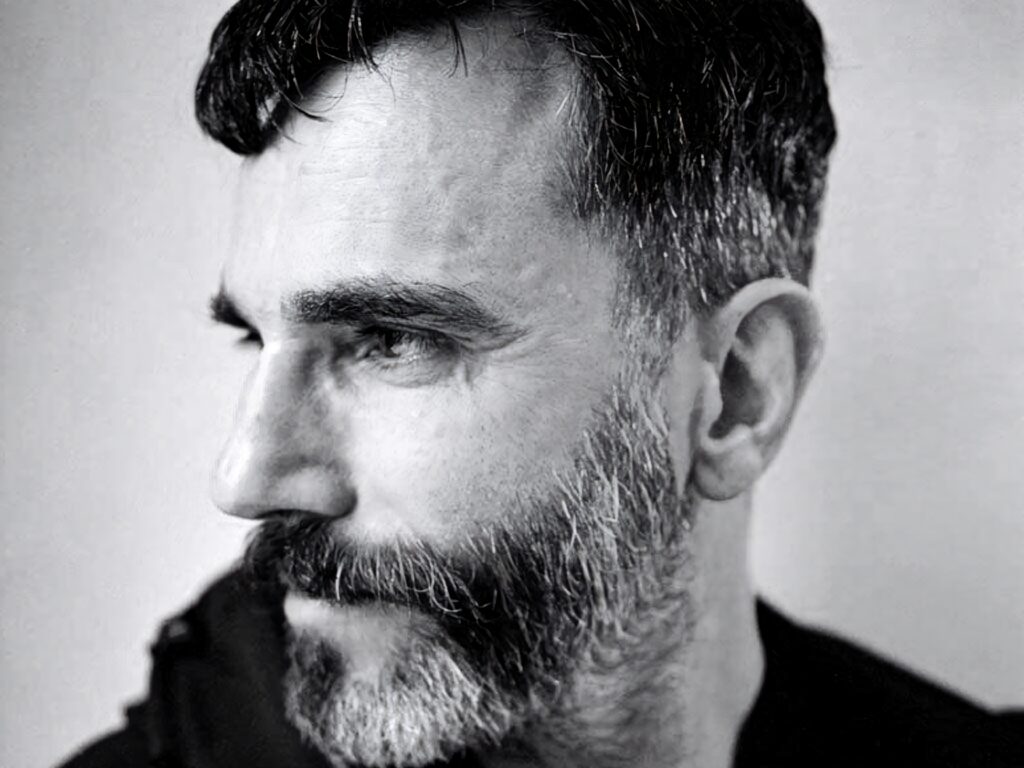 Close-up black and white portrait of Daniel Day-Lewis with beard dramatic lighting and intense gaze wallpaper