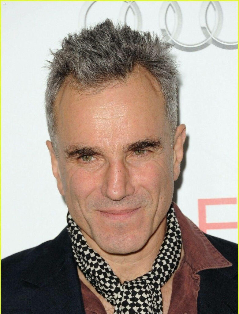 Daniel Day Lewis with short hair dark jacket patterned scarf confident expression wallpaper background
