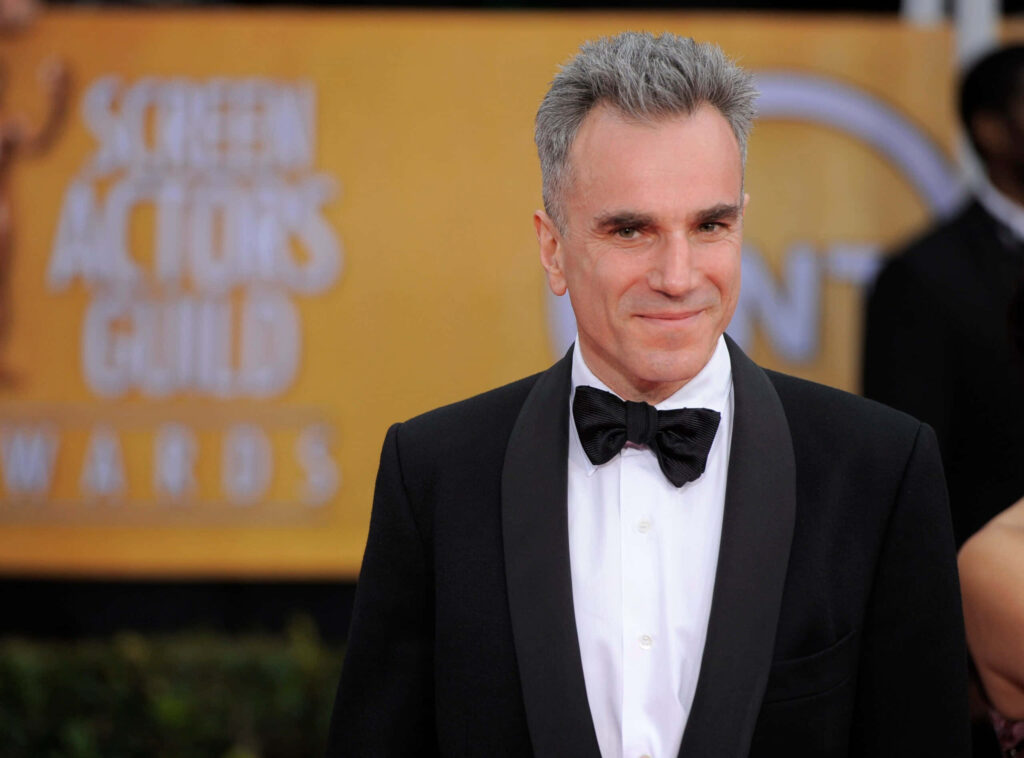 Daniel Day-Lewis in formal attire at Screen Actors Guild Awards with warm cinematic lighting Wallpaper