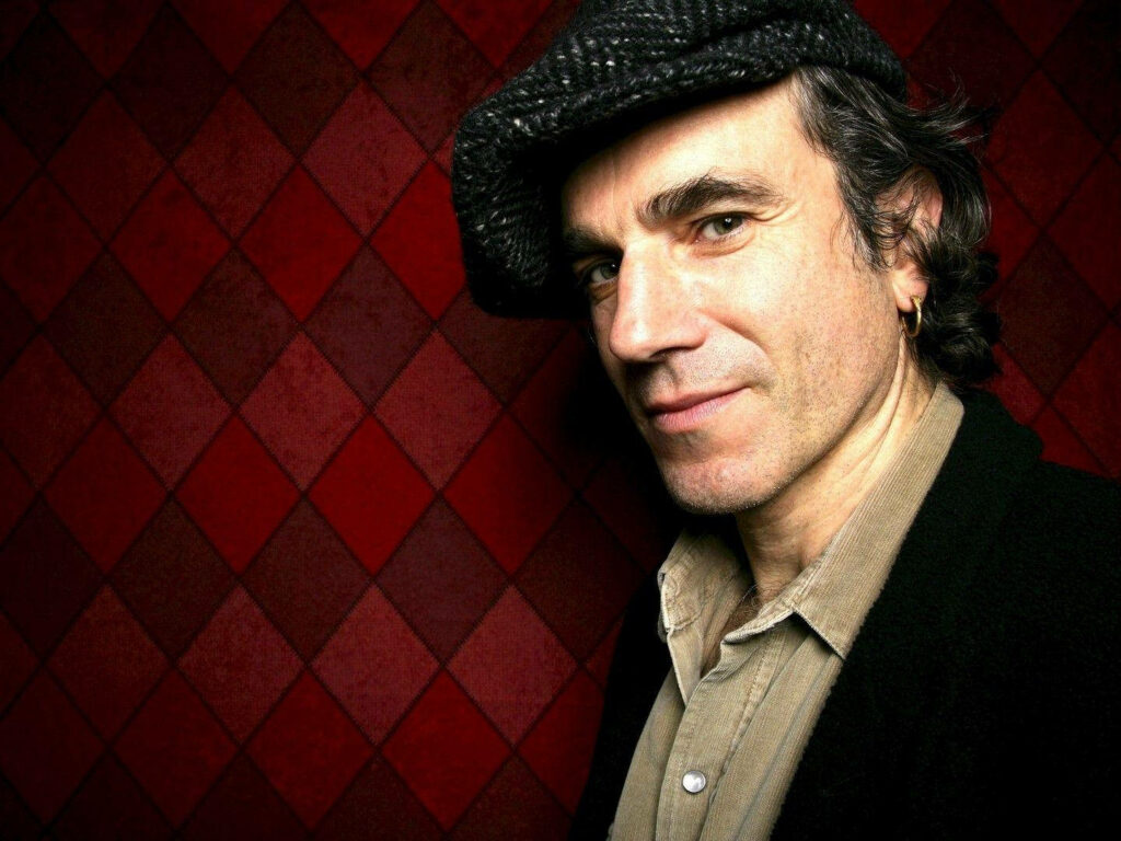 Daniel Day-Lewis wearing textured flat cap beige shirt dark jacket against red diamond background wallpaper