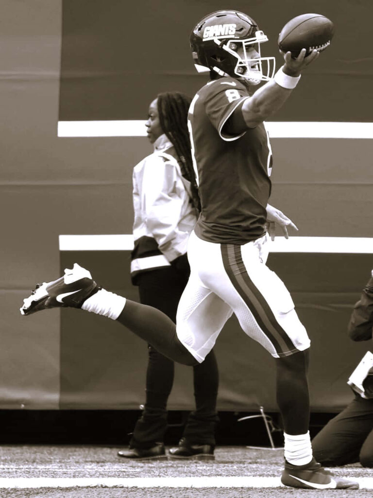 Daniel Jones New York Giants mid-celebration sepia tone football intensity wallpaper background