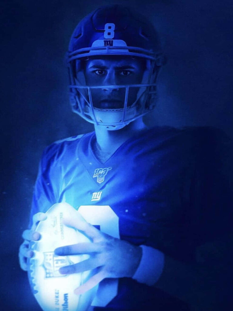 Daniel Jones New York Giants quarterback in blue lighting intense focused football portrait wallpaper