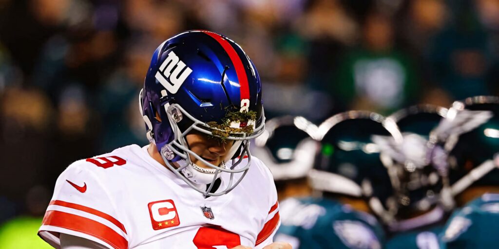 Daniel Jones New York Giants quarterback in blue and red helmet focused during NFL game wallpaper