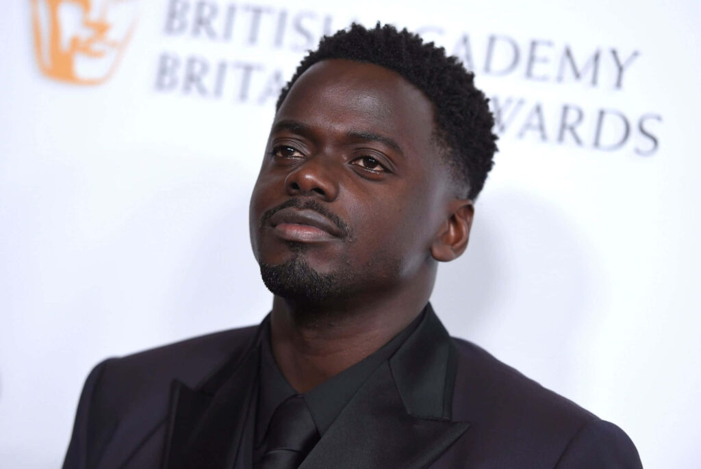 Daniel Kaluuya in black suit at British Academy award event confident portrait wallpaper background