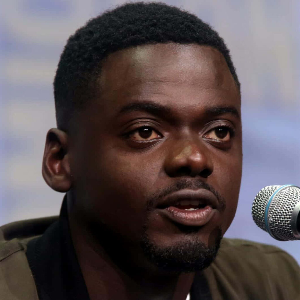 Daniel Kaluuya close-up speaking into microphone with expressive face and soft blurred background Wallpaper