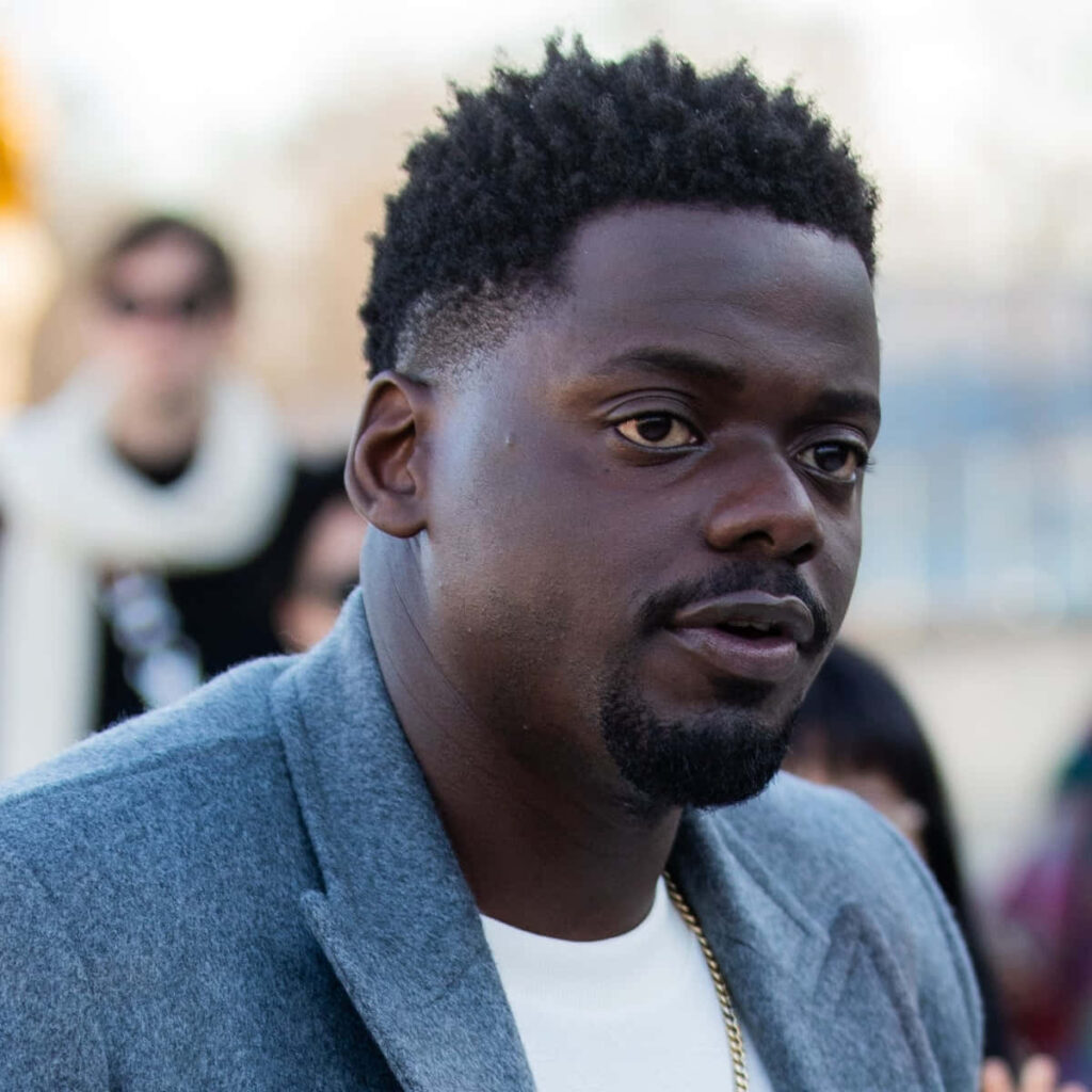 Daniel Kaluuya in light gray coat outdoors natural lighting calm thoughtful expression wallpaper