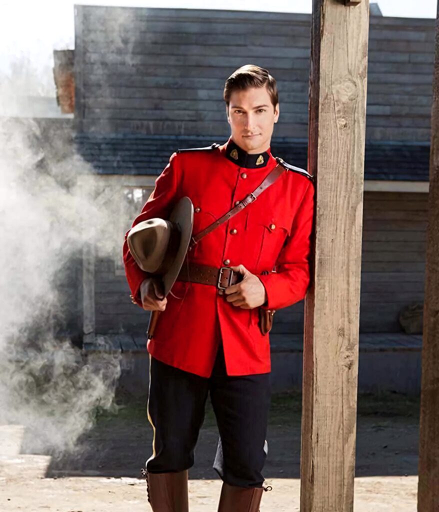 Daniel Lissing in red Royal Canadian Mounted Police uniform smoky rustic backdrop cinematic style Wallpaper
