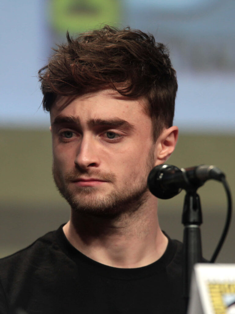 Daniel Radcliffe portrait with focused expression soft natural lighting neutral background wallpaper