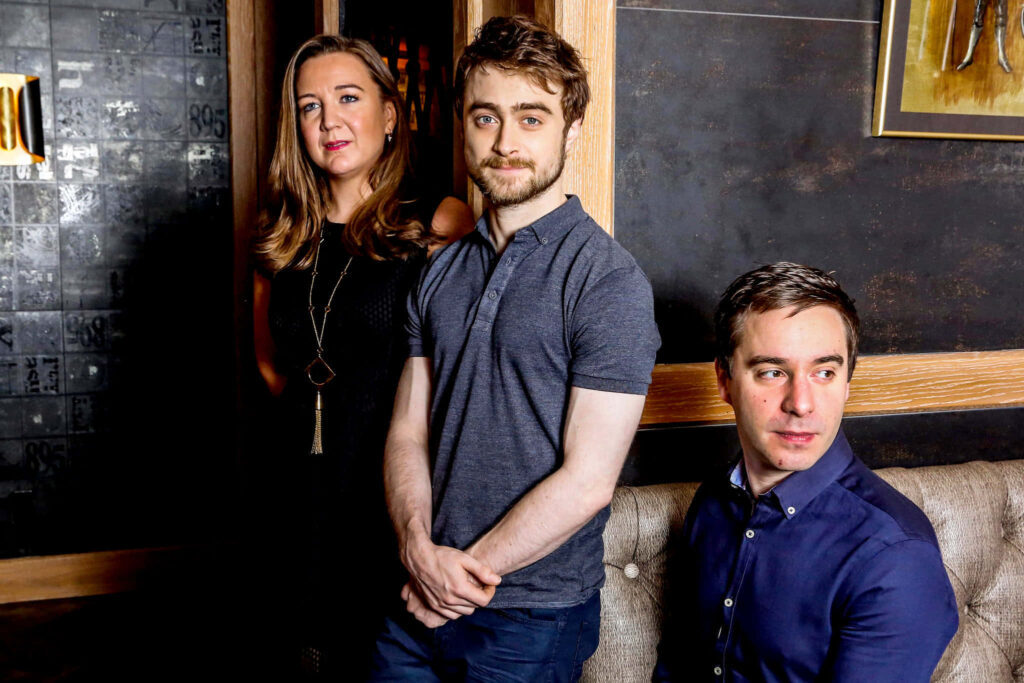 Daniel Radcliffe with playwright James Graham and director Josie Rourke in warm creative setting Wallpaper