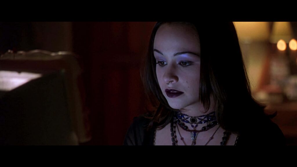 Danielle Harris in dramatic gothic scene with dark makeup and moody lighting for suspense fans Wallpaper