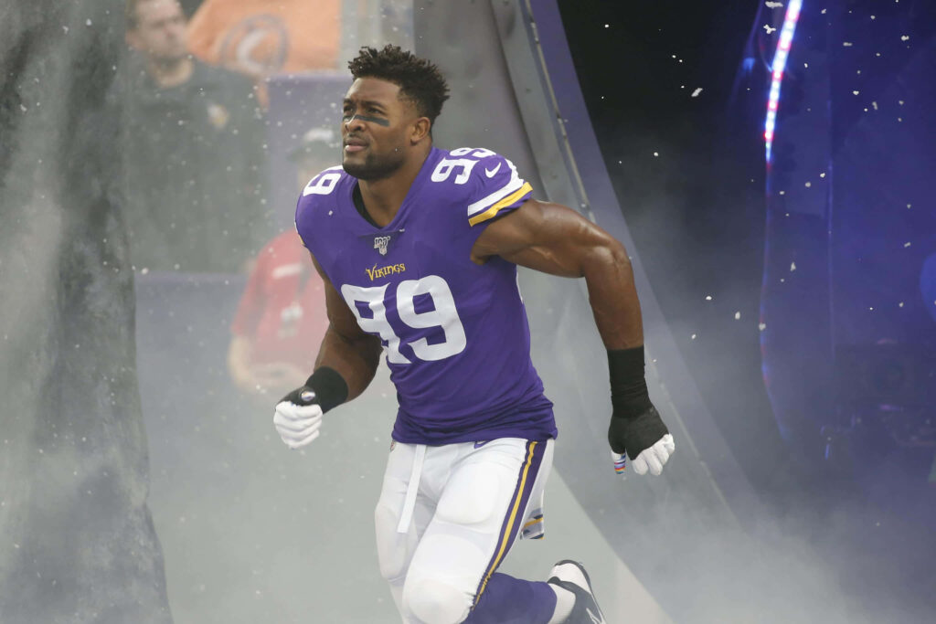 Danielle Hunter Minnesota Vikings football player in action dynamic digital art wallpaper background